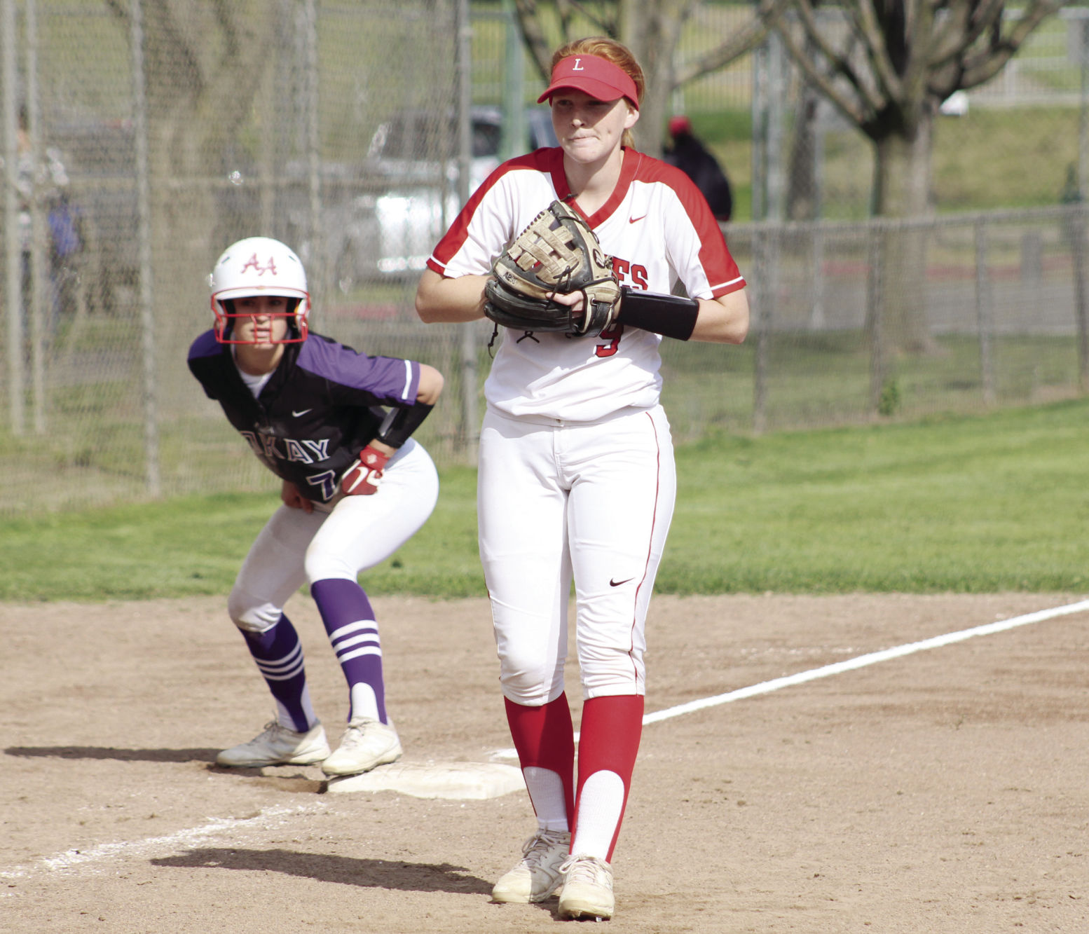 High school softball: Tigers’ bats cool off the Flames